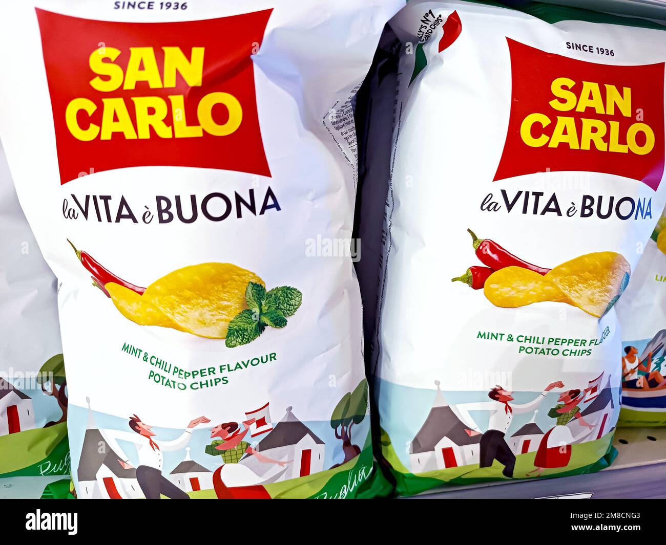 DUSHANBE, TAJIKISTAN - AUGUST 12, 2022:  Italian San Carlo potato chips with mint and chili pepper package on the display shelf in the grocery store c Stock Photo