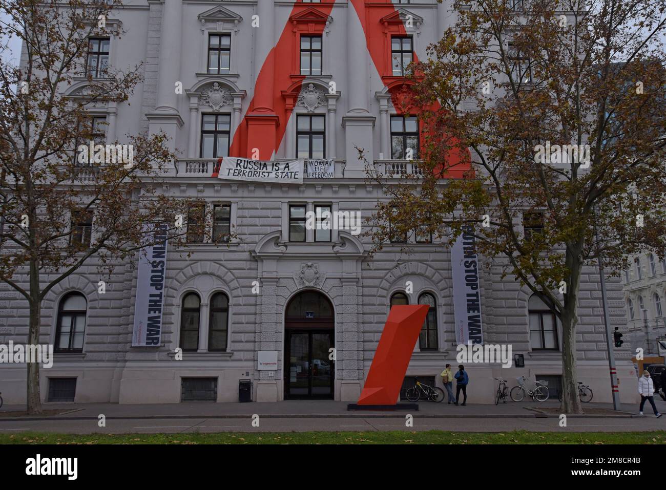 Banners & slogans protesting about Putin & The War in Ukraine on the front of the University Library of University for Applied Art of Vienna, Austria Stock Photo
