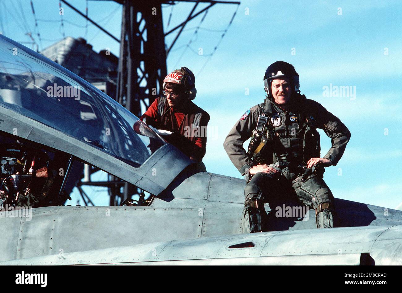 A radar intercept officer (RIO) from Fighter Squadron 14 (VF14) sits