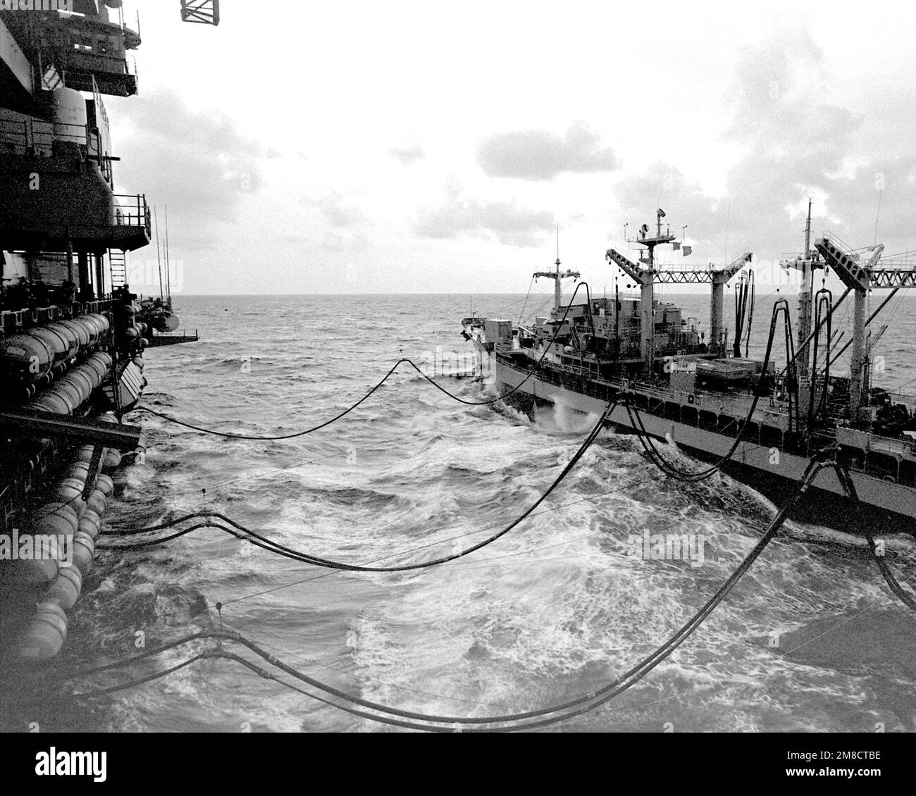 The fleet oiler USNS NEOSHO (TAO143) steams alongside the aircraft