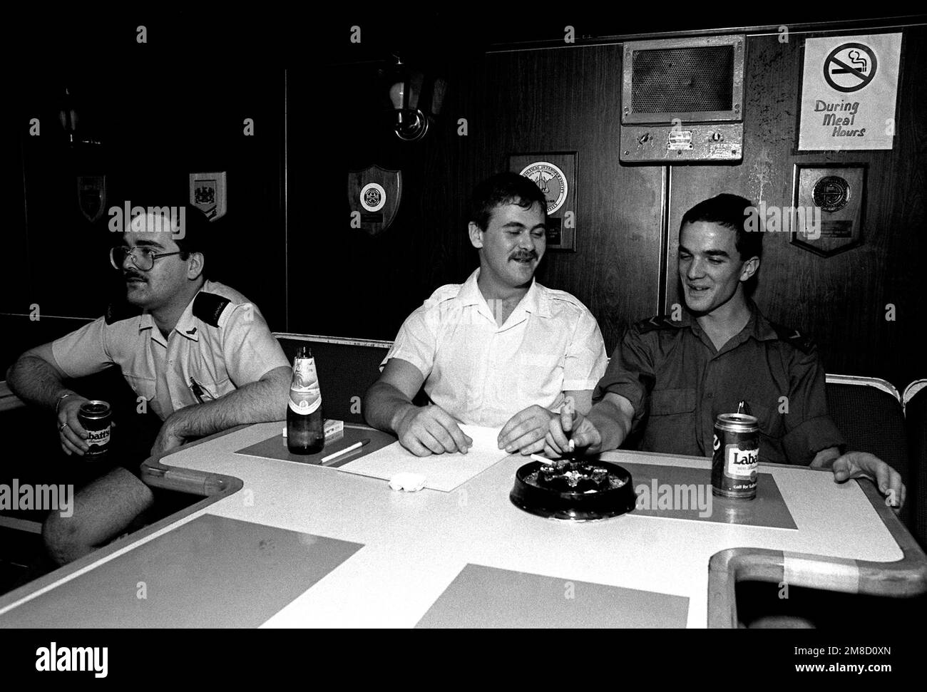 Off-duty sailors relax in the enlisted men's mess aboard the Canadian frigate HMCS MARGAREE (DDH 230) during FLEET EX 1-90. Subject Operation/Series: FLEET EX 1-90 Base: Hmcs Margaree (DDH 230) Country: Atlantic Ocean (AOC) Stock Photo
