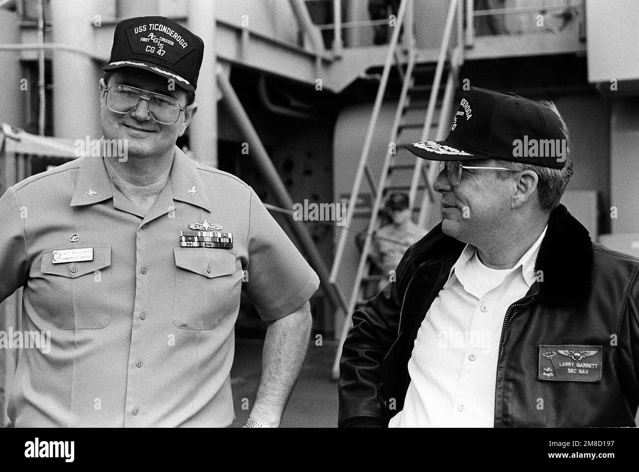 Secretary of the Navy H. Lawrence Garrett III converses with CAPT M.C. Foote, Commanding Officer