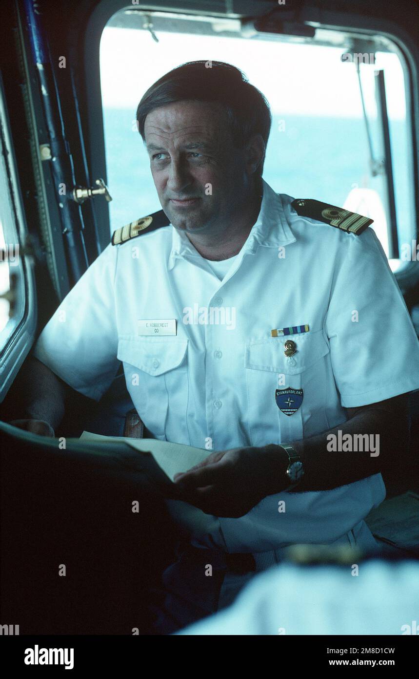 A Dutch navy officer looks out from the bridge of the frigate HR MS CALLENBURGH (F-808) during Fleet Ex 1-90. Subject Operation/Series: FLEET EX 1-90 Base: Hr Ms Callenburgh (F-808) Country: Atlantic Ocean (AOC) Stock Photo
