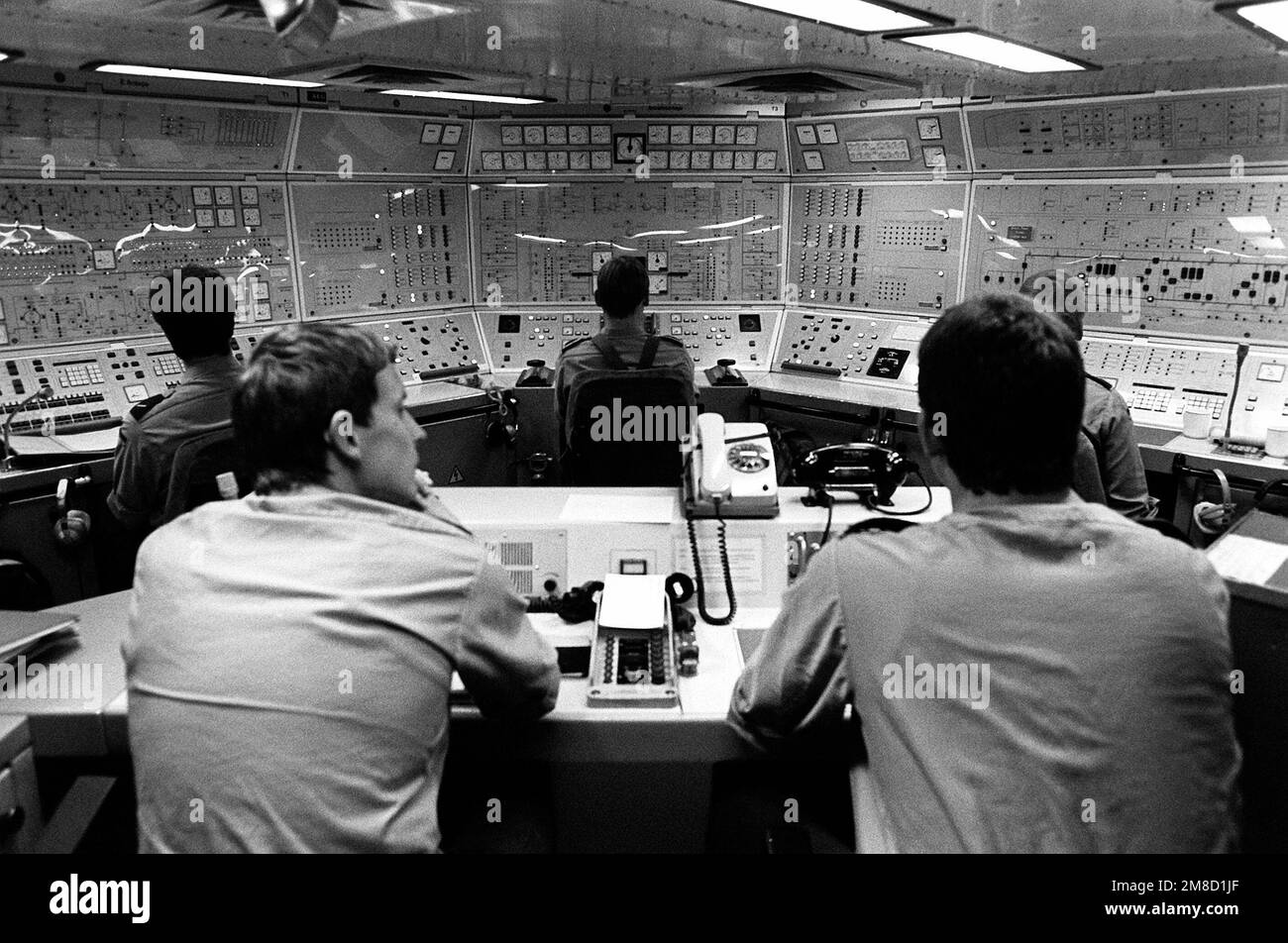 Sailors monitor some of the ship's systems from a control room in the
