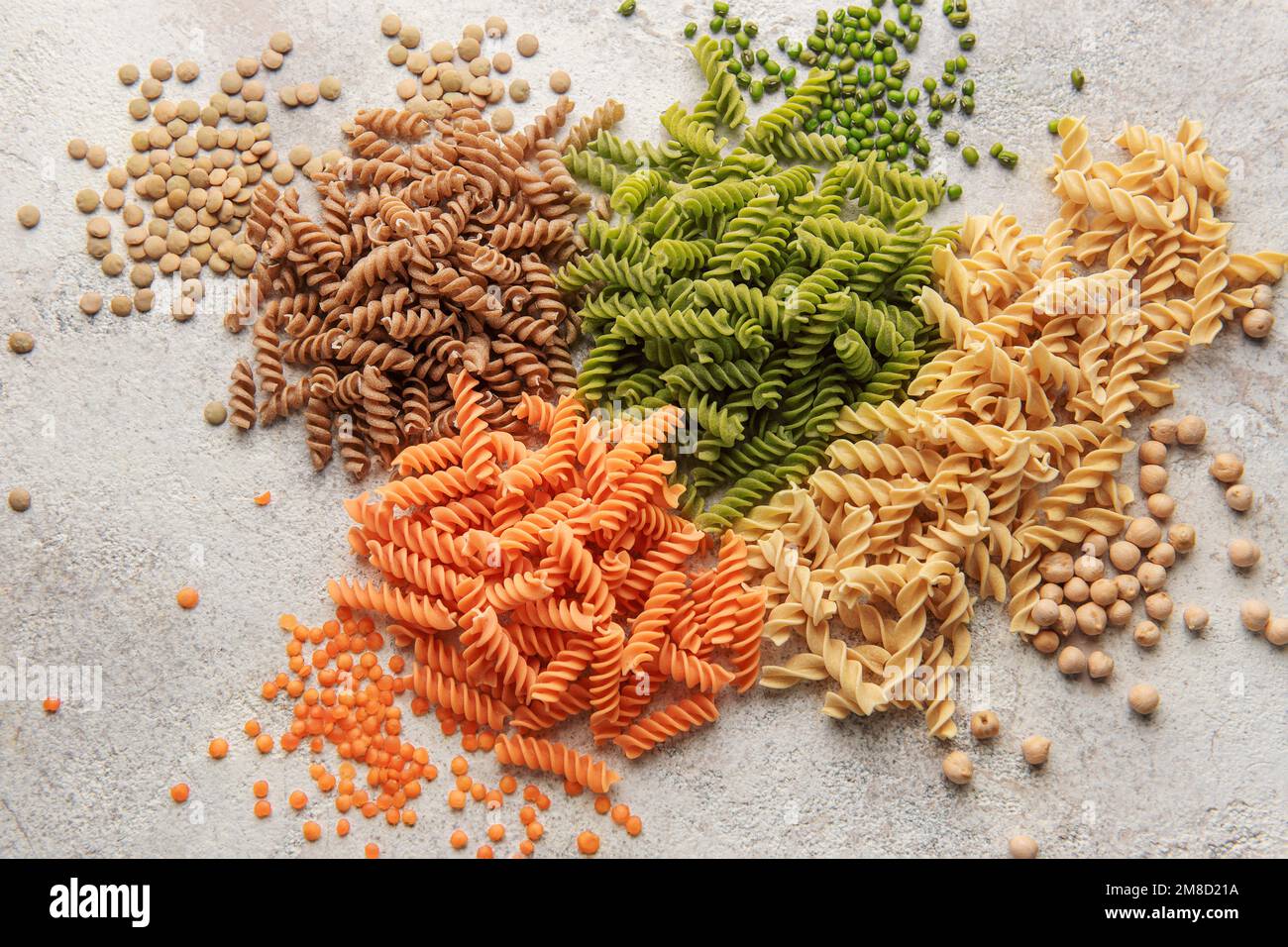 A variety of fusilli pasta made from different types of legumes, green and red lentils, mung