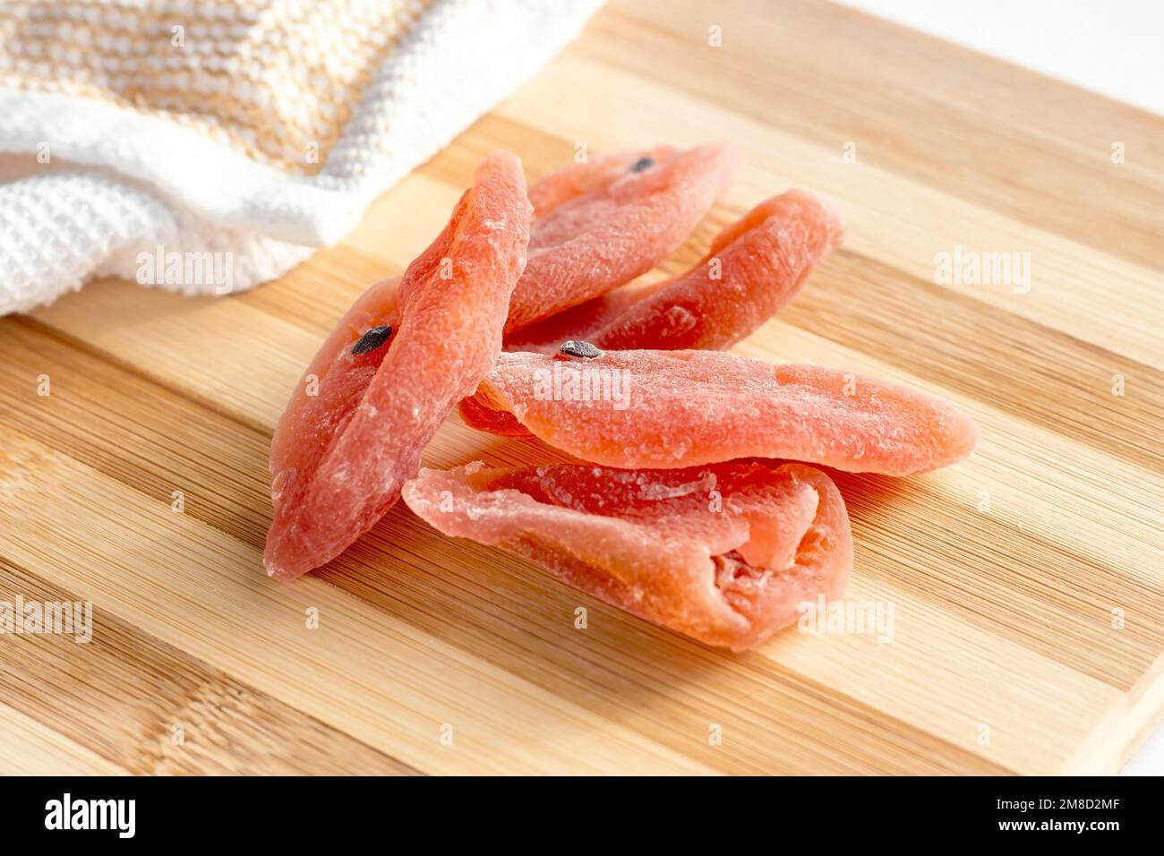 Dried tropical organic natural passion fruit with sugar on the wooden board background in the kitchen. Stock Photo