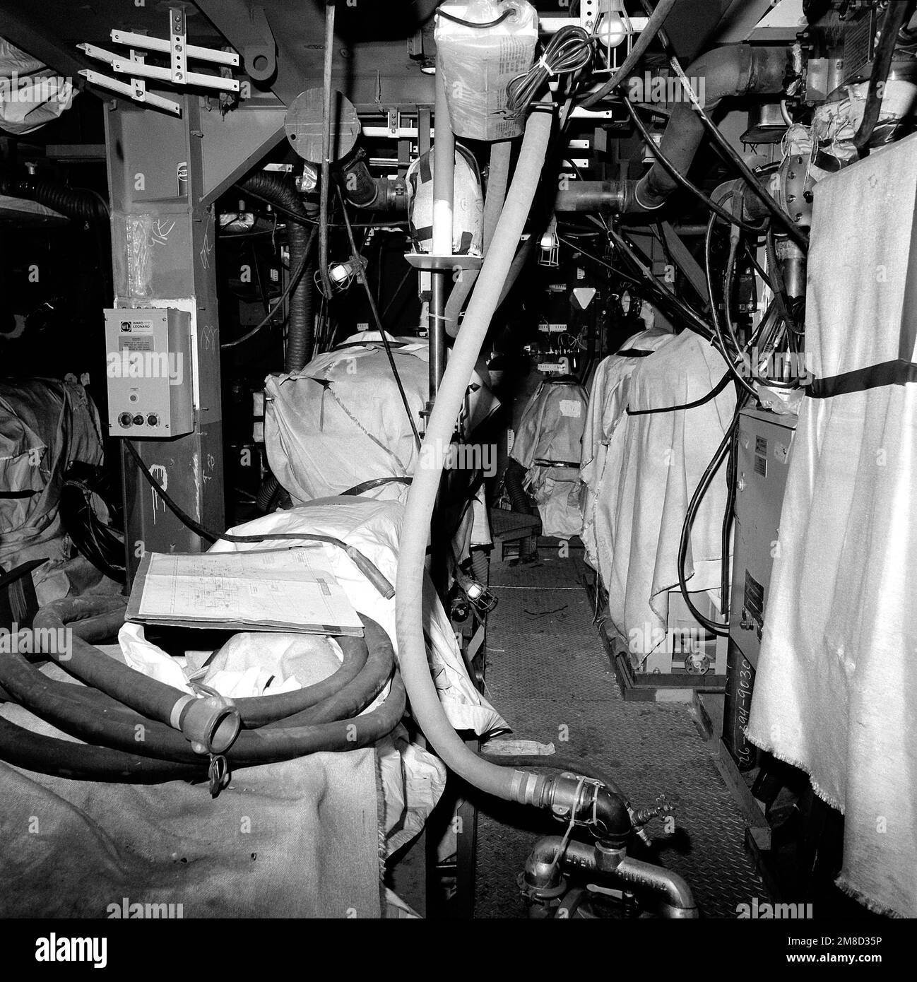 A view of main engine room No. 1 aboard the guided missile cruiser SHILOH (CG 67). The ship is 40 percent complete. Base: Bath State: Maine (ME) Country: United States Of America (USA) Stock Photo