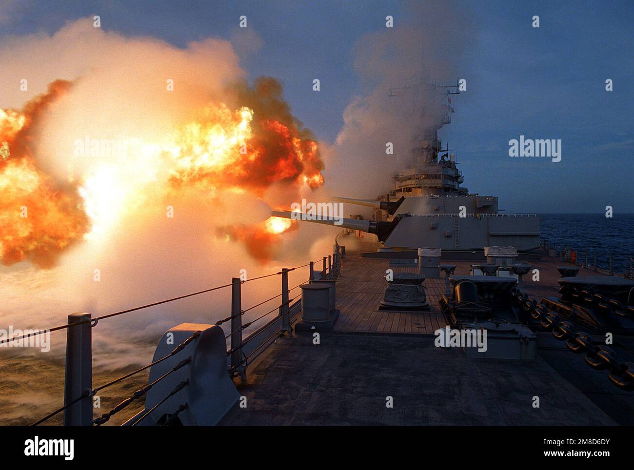 The battleship USS MISSOURI (BB-63) fires a Mark 7 16-inch /50-caliber gun  from each of its three main gun turrets seconds after firing a previous  salvo during Exercise RimPac '90 near Hawaii., image size:1300x964