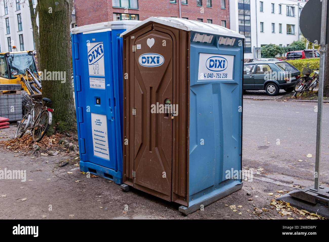 Hamburg, Germany - 12 03 2022: Two DIXI toilet cubicles on a construction site in Hamburg Germany Stock Photo