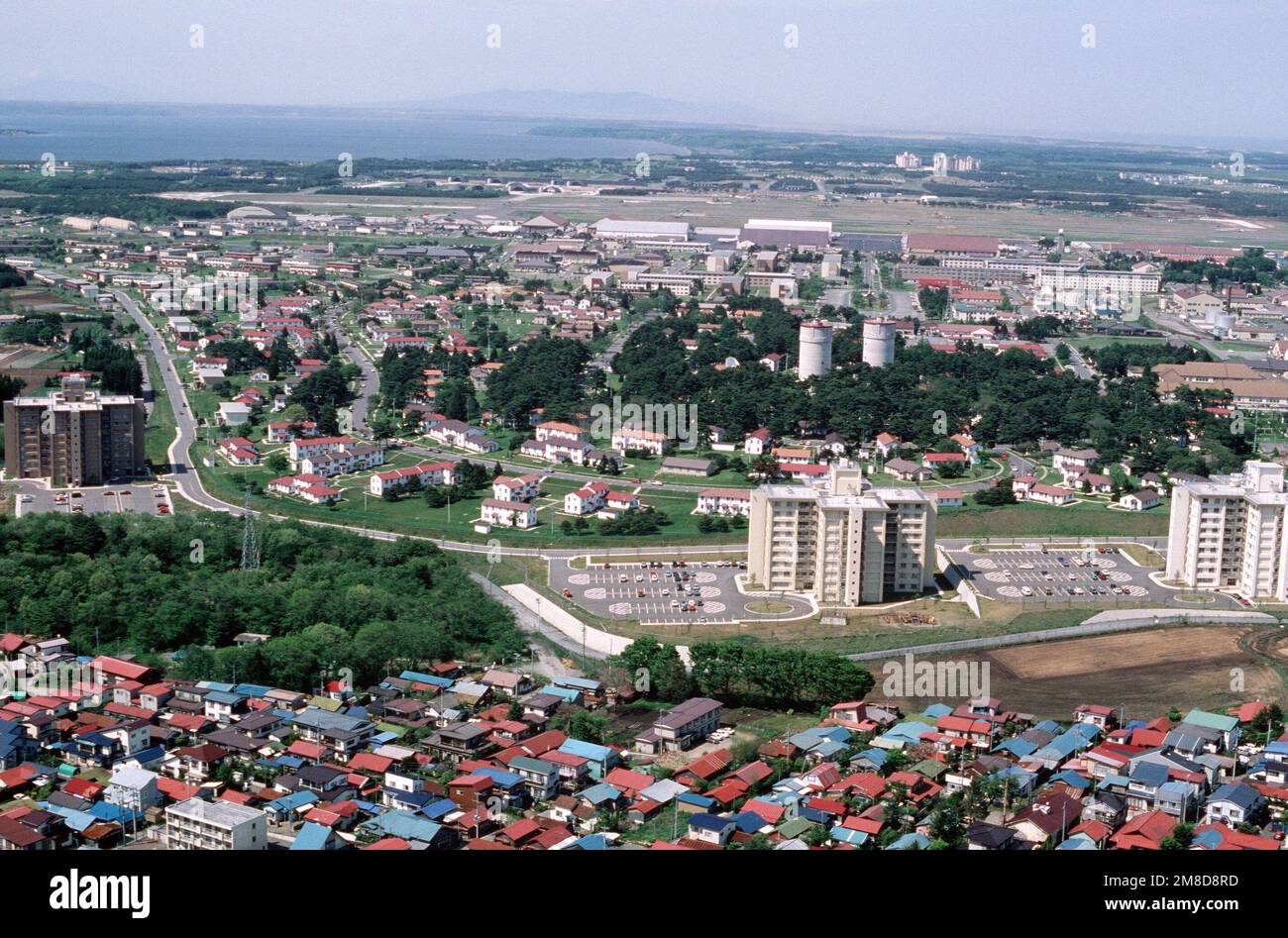 An aerial view of a portion of the base and the surrounding city of
