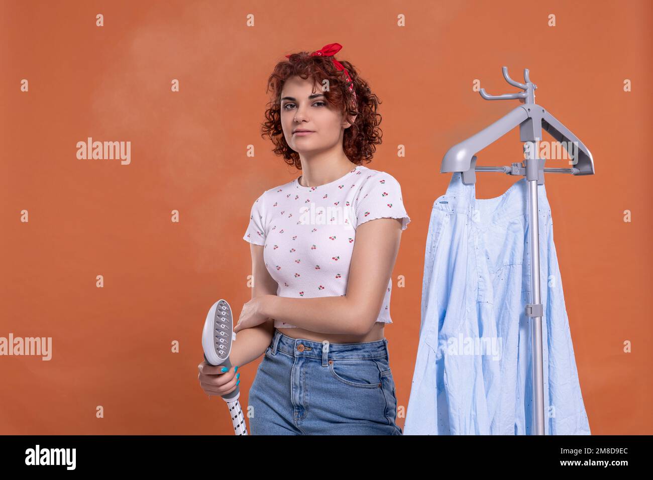 A smile on your face. A steamer for ironing. A girl with curly hair