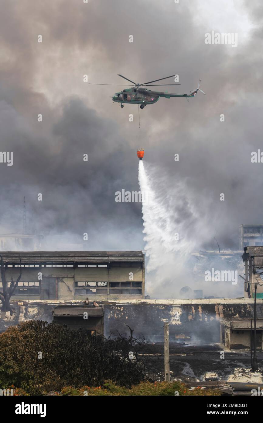 A vertical shot of Cuban armed forces helicopter, putting out the fire