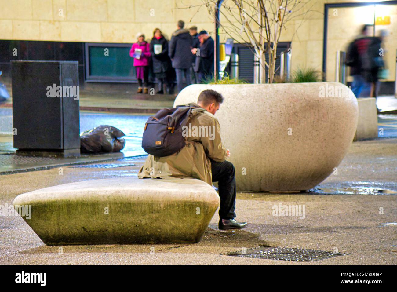 Glasgow, Scotland, UK 13th January, 2023. UK Weather :lone traveller outside station  Wet and windy saw  late night shopping outside the awrd winning queen street station  in the city centre. Credit Gerard Ferry/Alamy Live News Stock Photo