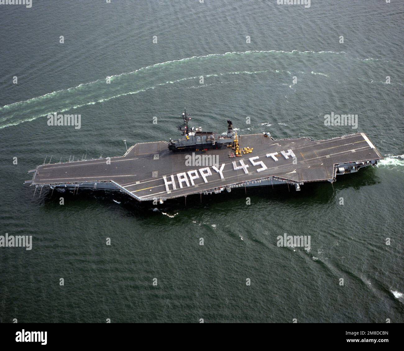 Crewmen on the flight deck of the aircraft carrier USS MIDWAY (CV41