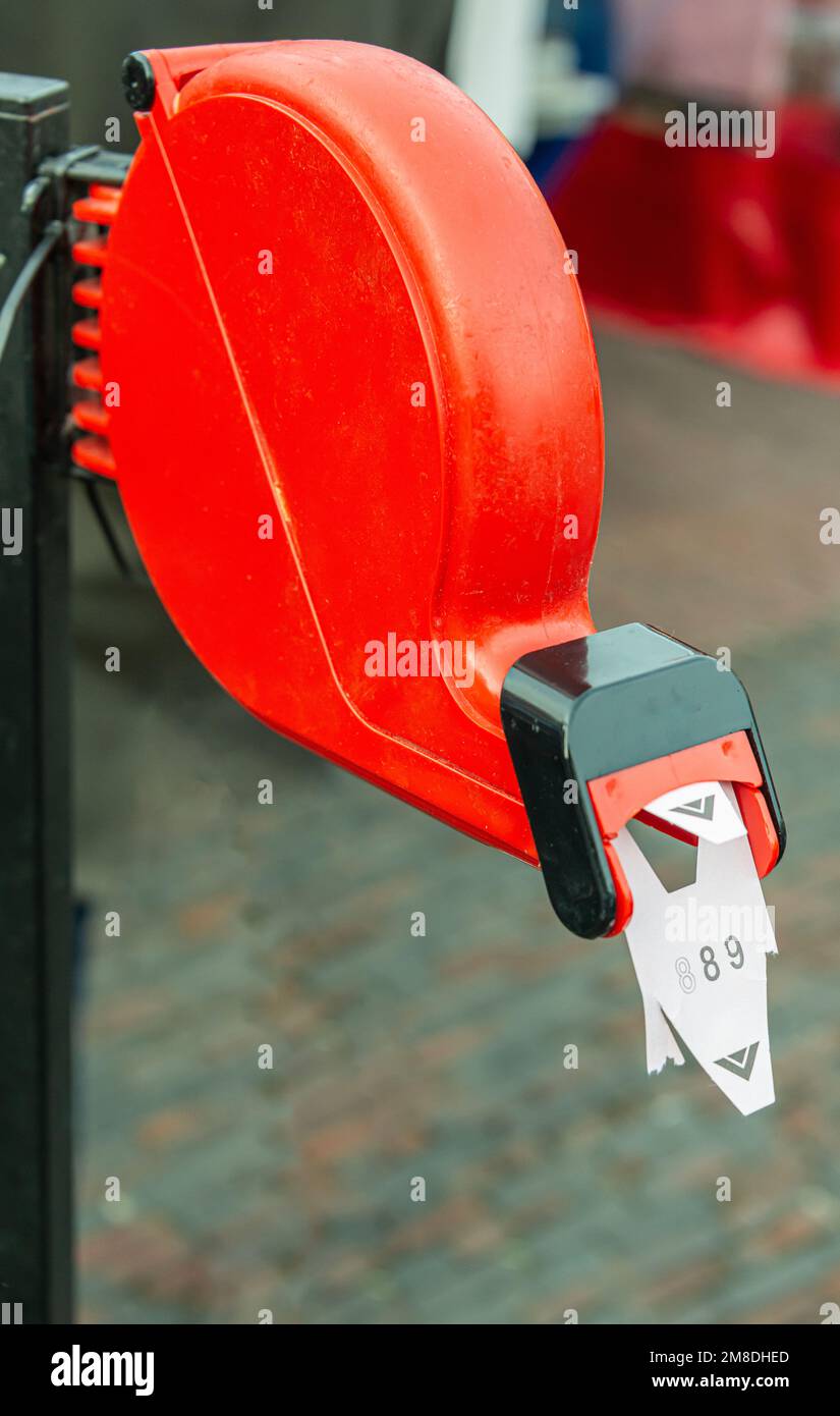 red sequence number dispenser Stock Photo