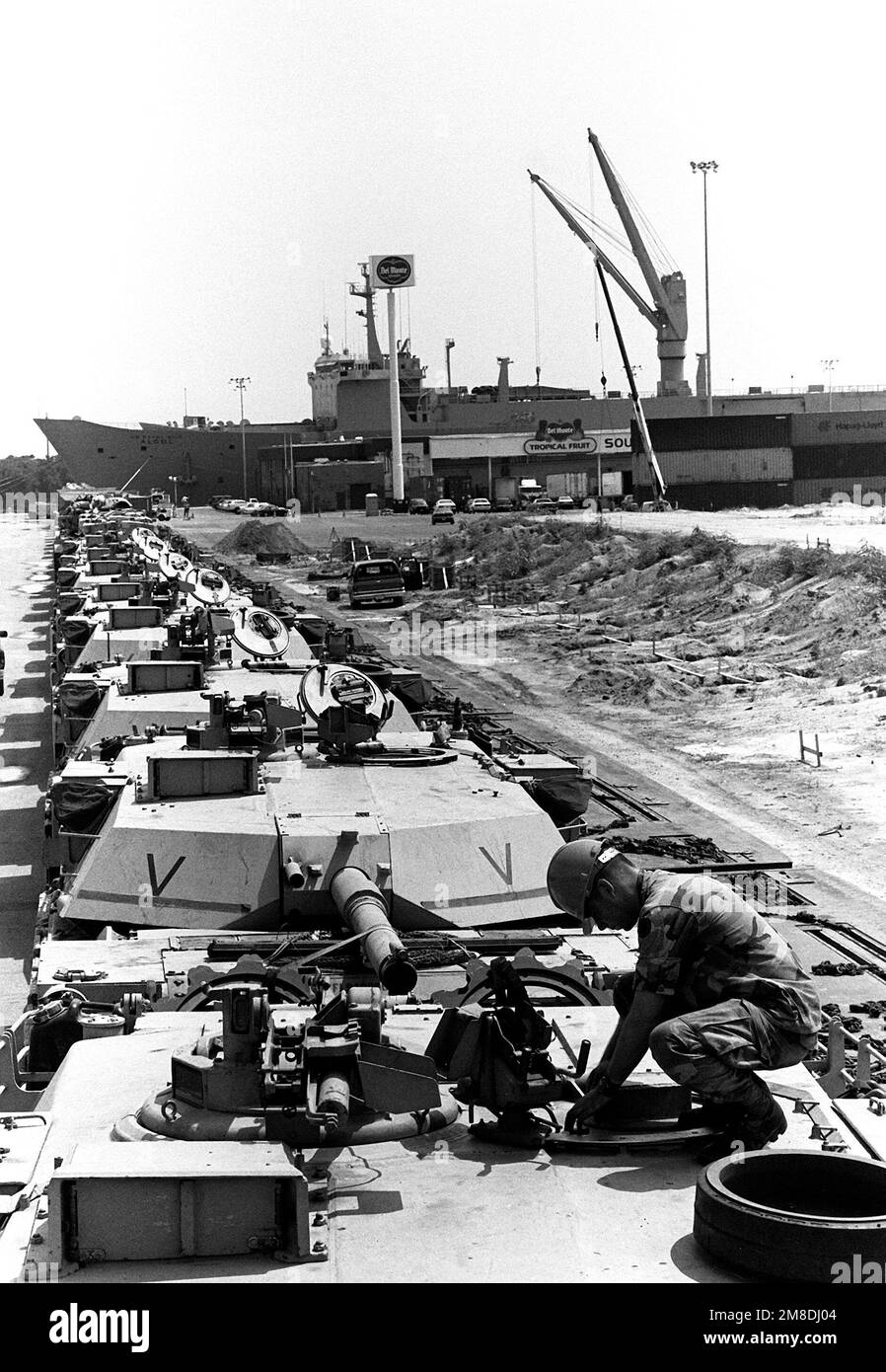 M-1 Abrams main battle tanks line the pier in preparation for loading aboard the rapid-response vehicle cargo ship USNS ALGOL (AKR-287). The equipment will be transported to Saudi Arabia in support of Operation Desert Shield. Subject Operation/Series: DESERT SHIELD Base: Savannah State: Georgia (GA) Country: United States Of America (USA) Stock Photo