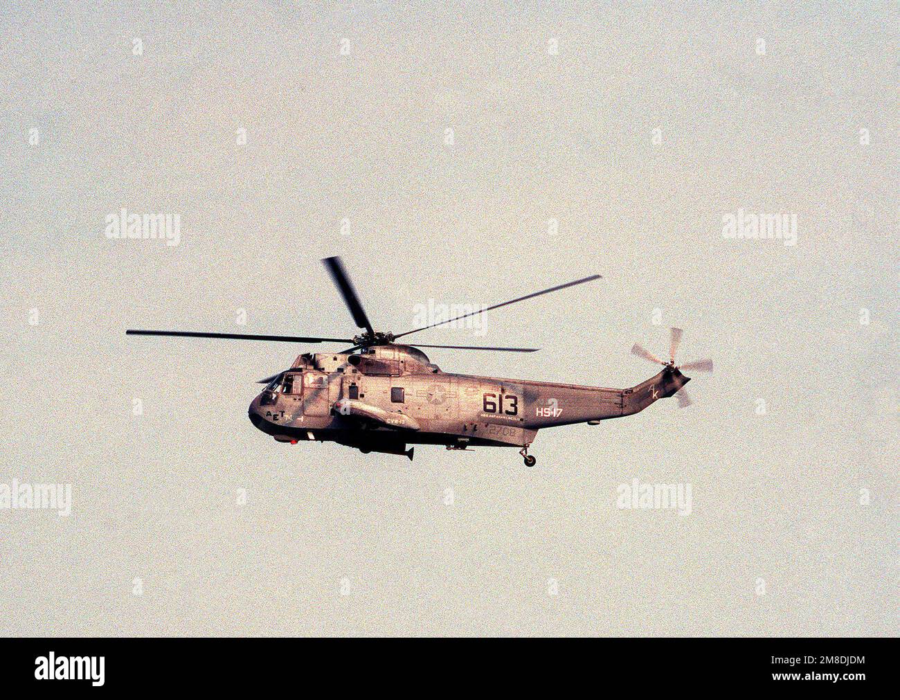 A Helicopter Anti-submarine Squadron 17 (HS-17) SH-3H Sea King ...