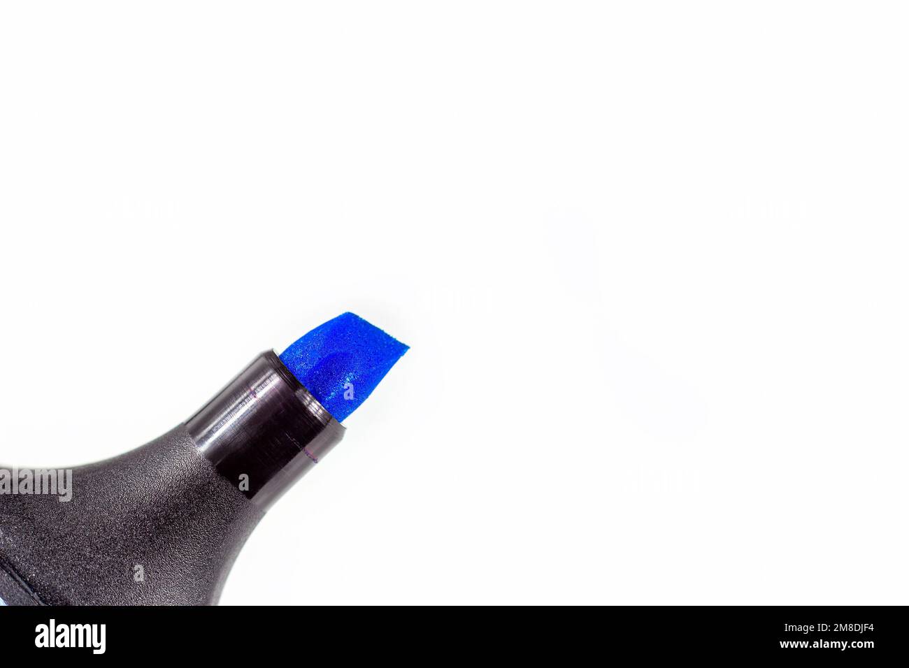 Black marker pen with bright blue tip on light background close up with copy space. Stock Photo