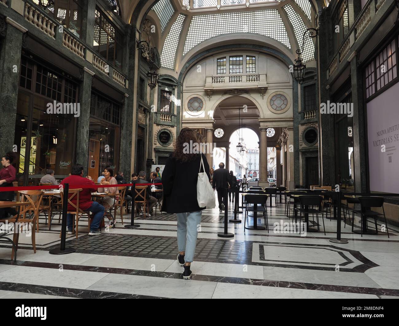 TURIN, ITALY - CIRCA SEPTEMBER 2022: People in Galleria San Federico arcade Stock Photo