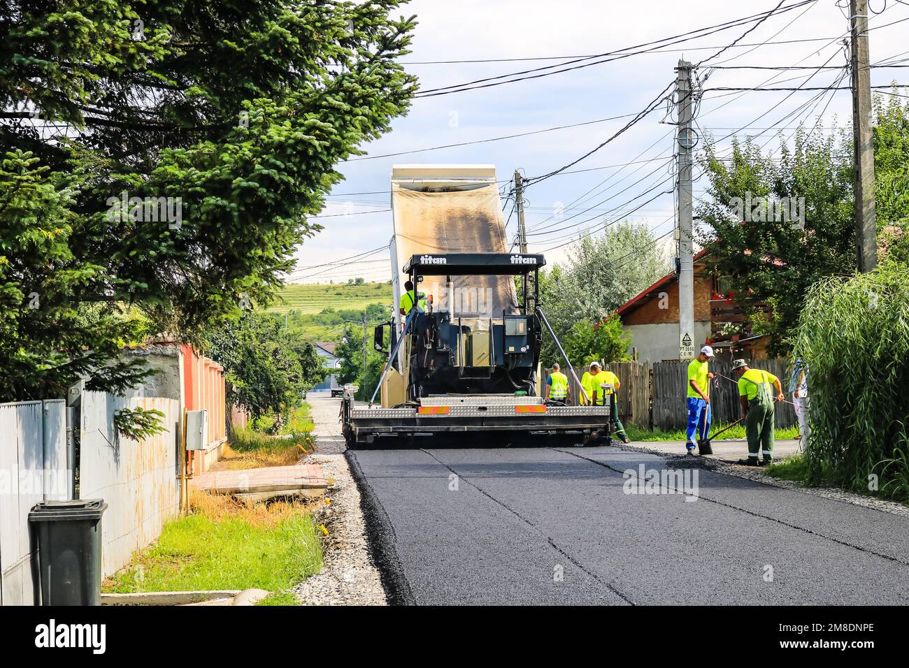 Workers and asphalting machines. Construction, asphalting of new road ...