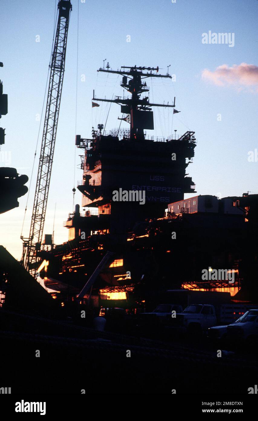 Light from the setting sun bathes the starboard side of the nuclear