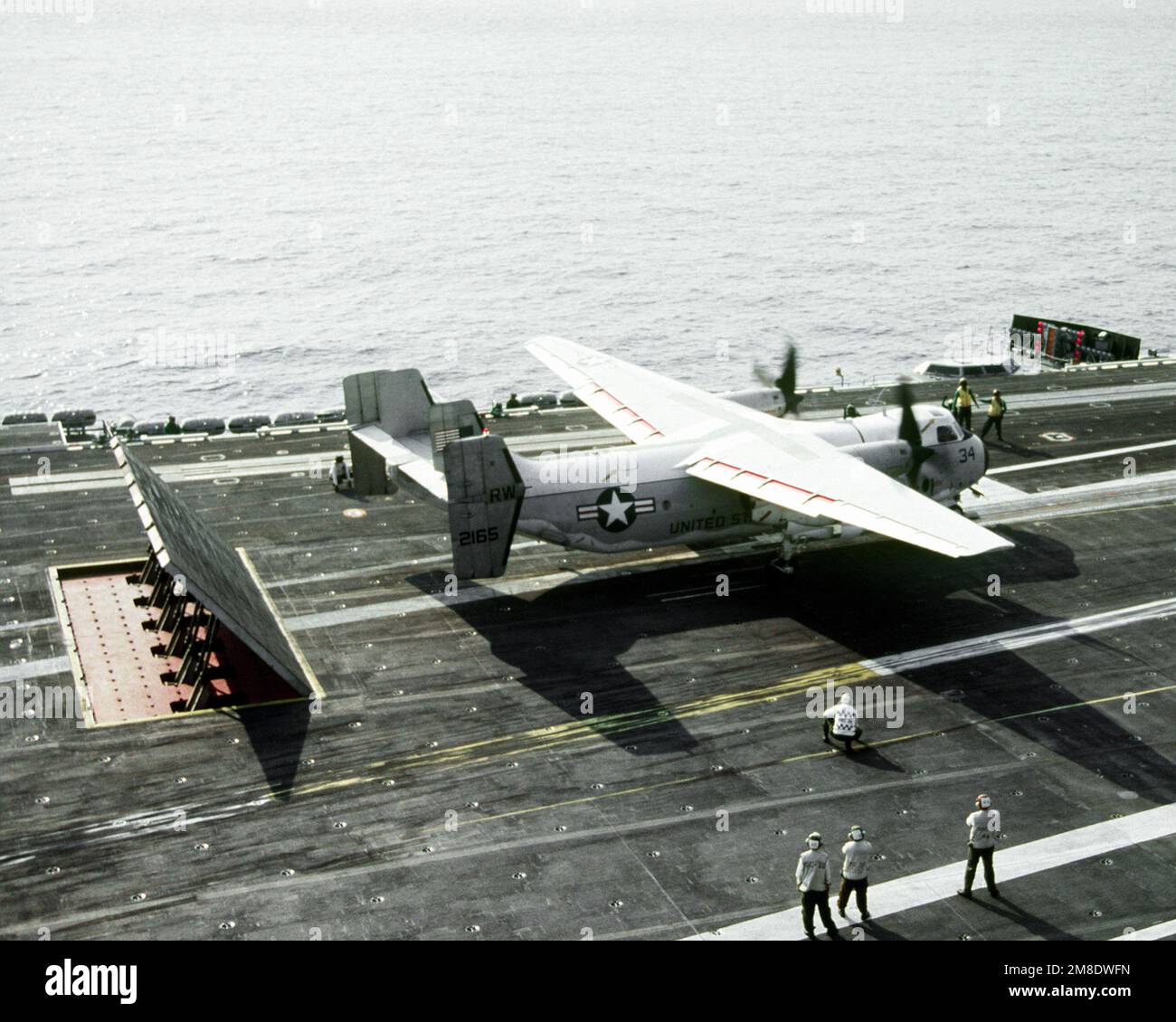 A Fleet Logistic Support Squadron 30 (VRC-30) C-2A Greyhound aircraft stands ready for launch on the No. 3 catapult on the flight deck of the nuclear-powered aircraft carrier USS ABRAHAM LINCOLN (CVN-72). Country: Atlantic Ocean (AOC) Stock Photo