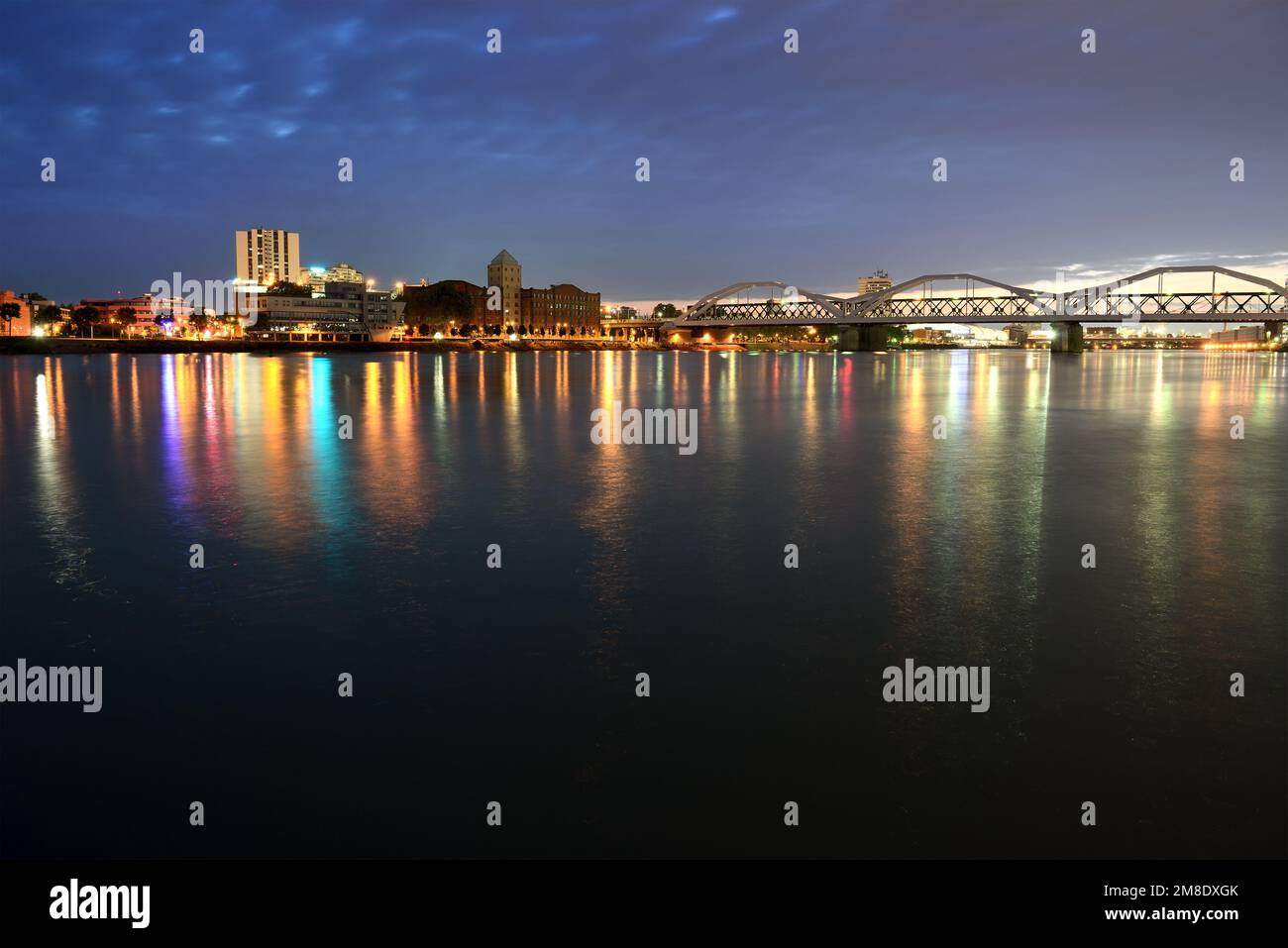 Night city and bridge across river Stock Photo