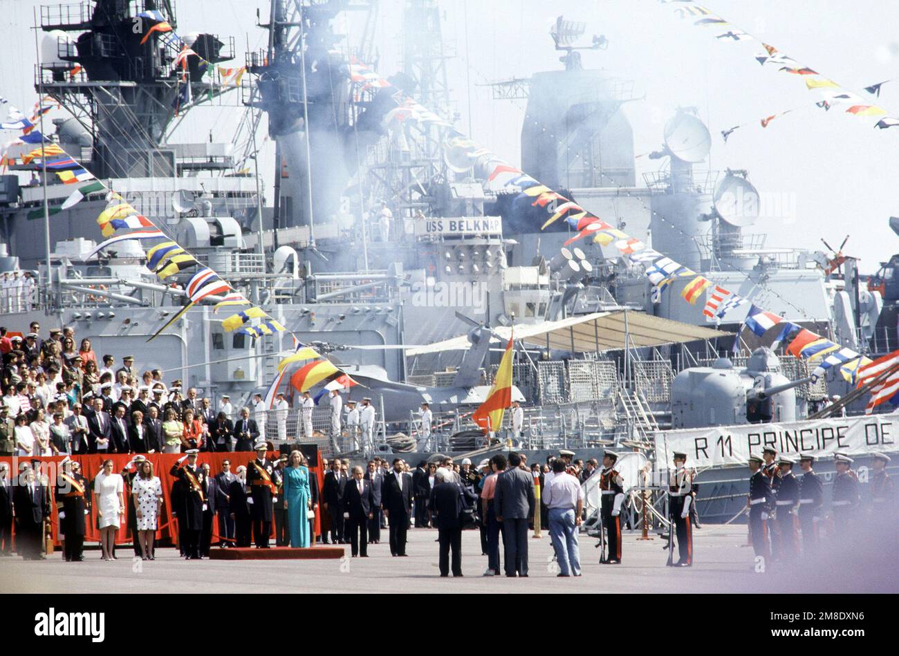 Smoke clears around the guided missile cruiser USS BELKNAP (CG 26) and ...