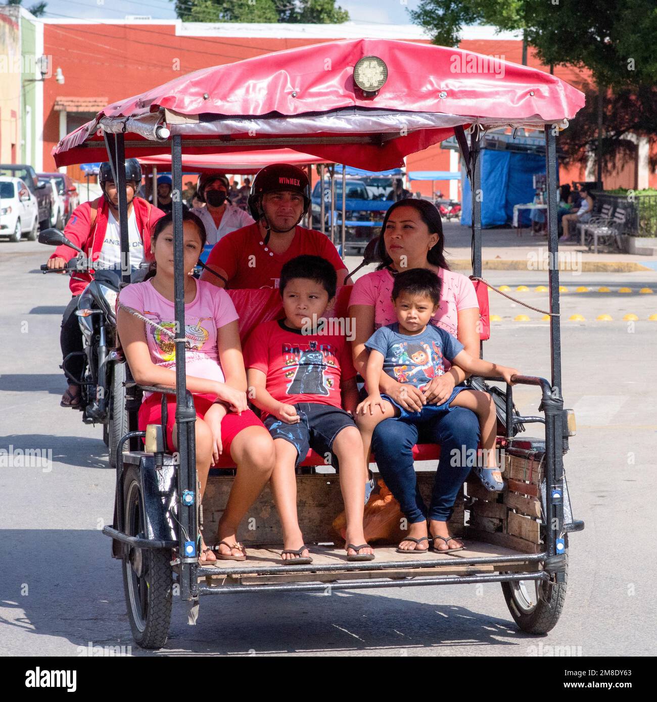 Mexican family on a tricycle, Yucatan, Mexico Stock Photo