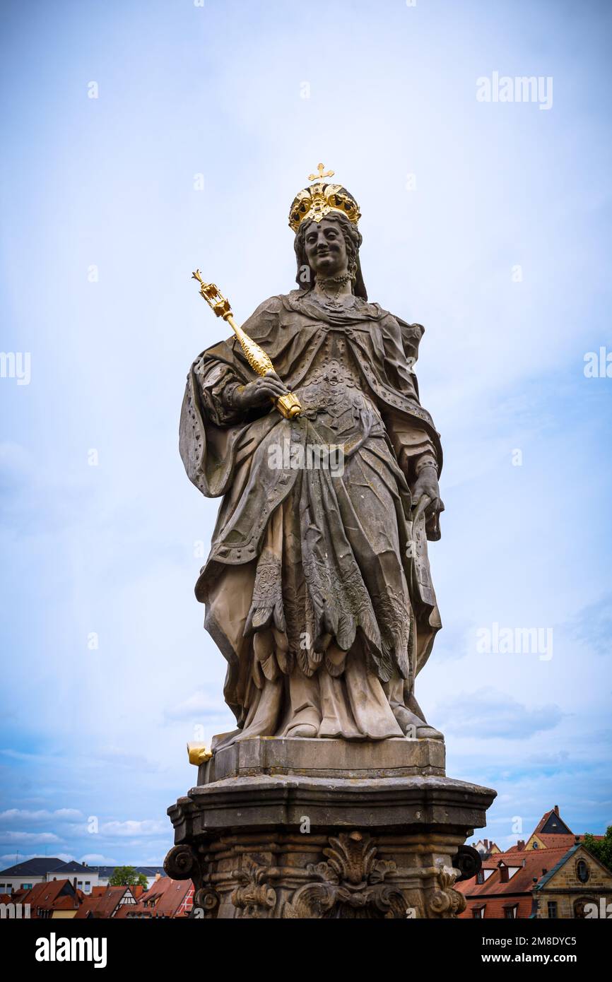 A vertical shot of the statue of St. Kunigunde in the old Bamberg town against the blue sky
