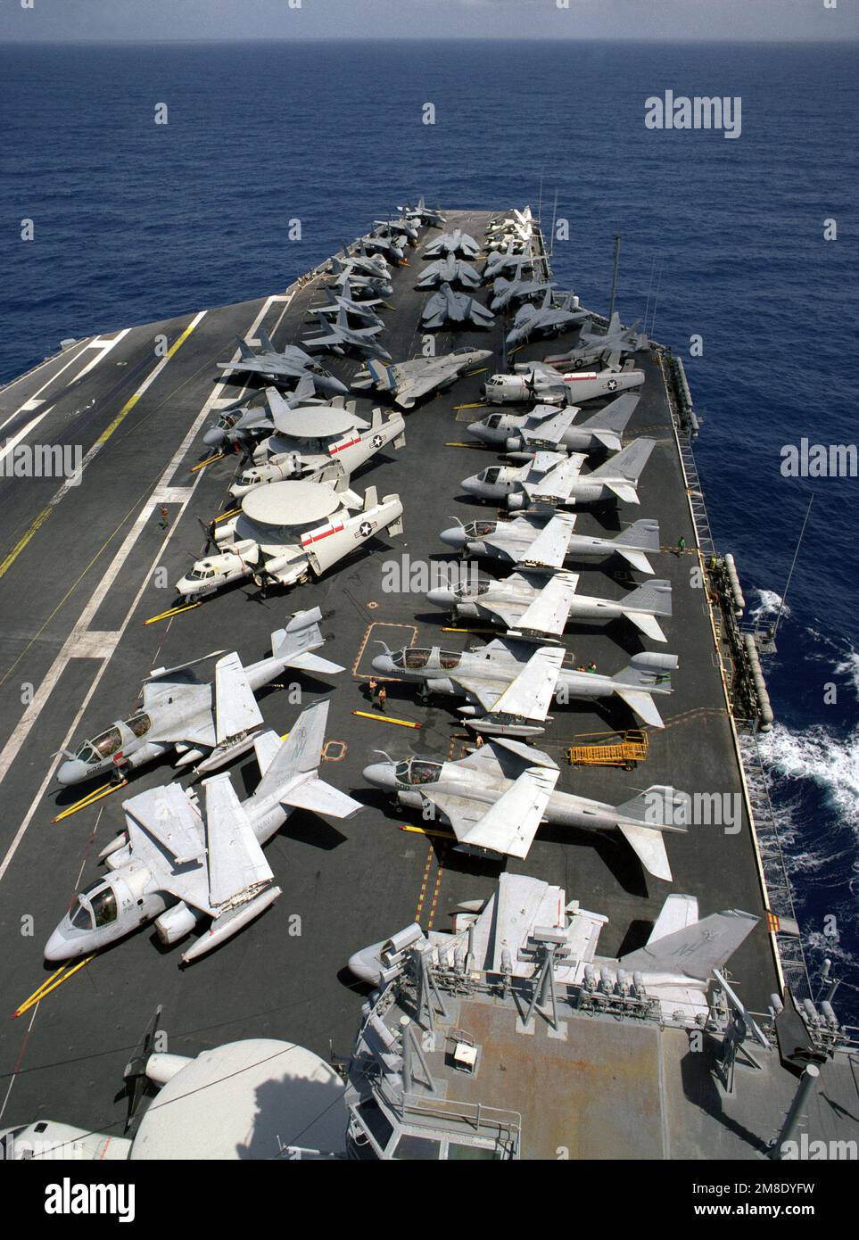 Various aircraft line the flight deck of the nuclearpowered aircraft