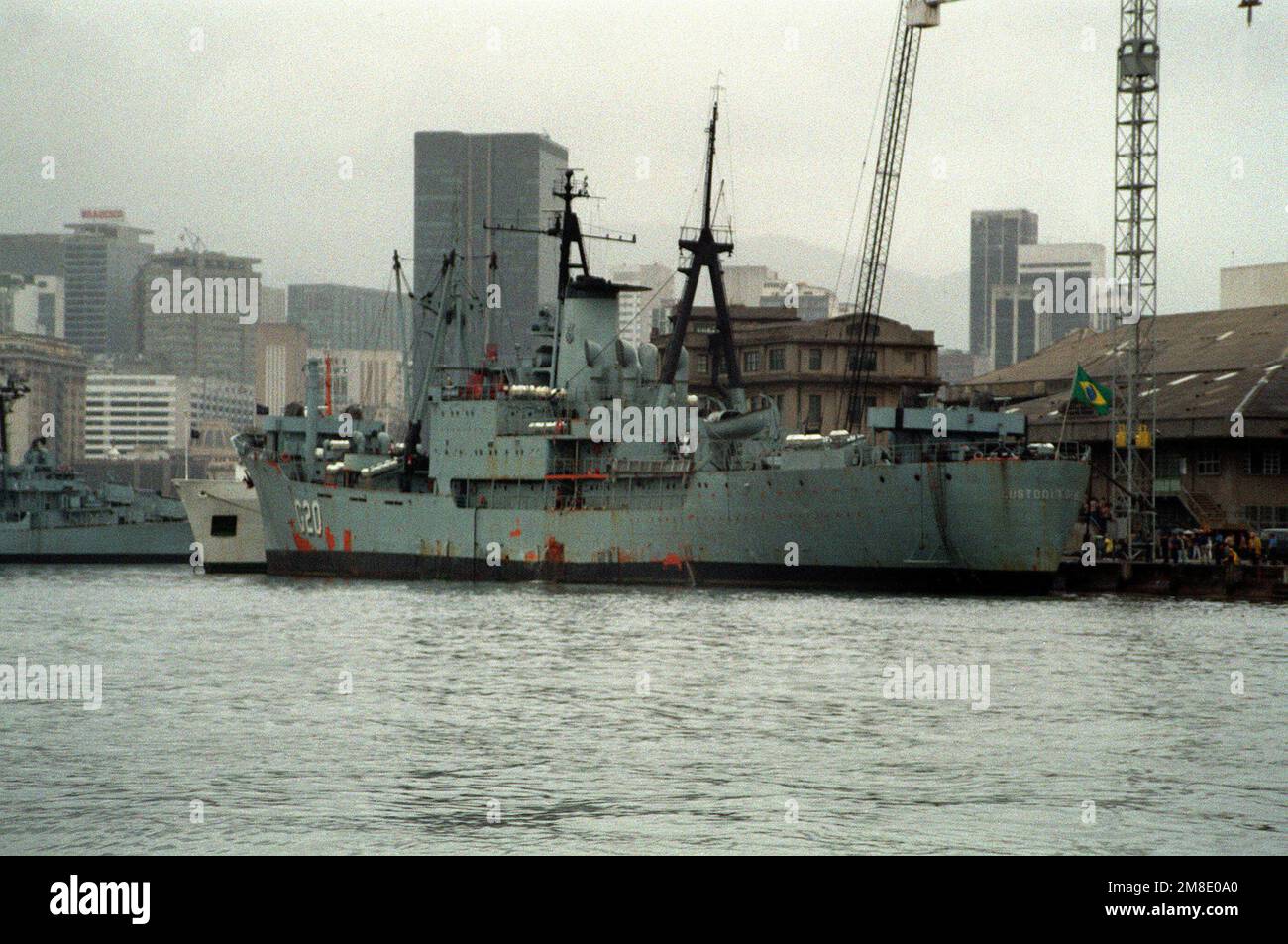 A port quarter view of the Brazilian transport ship CUSTODIO DE MELLO (G-20) tied up along the east wall of the naval base. Base: Rio De Janeiro Country: Brazil (BRA) Stock Photo