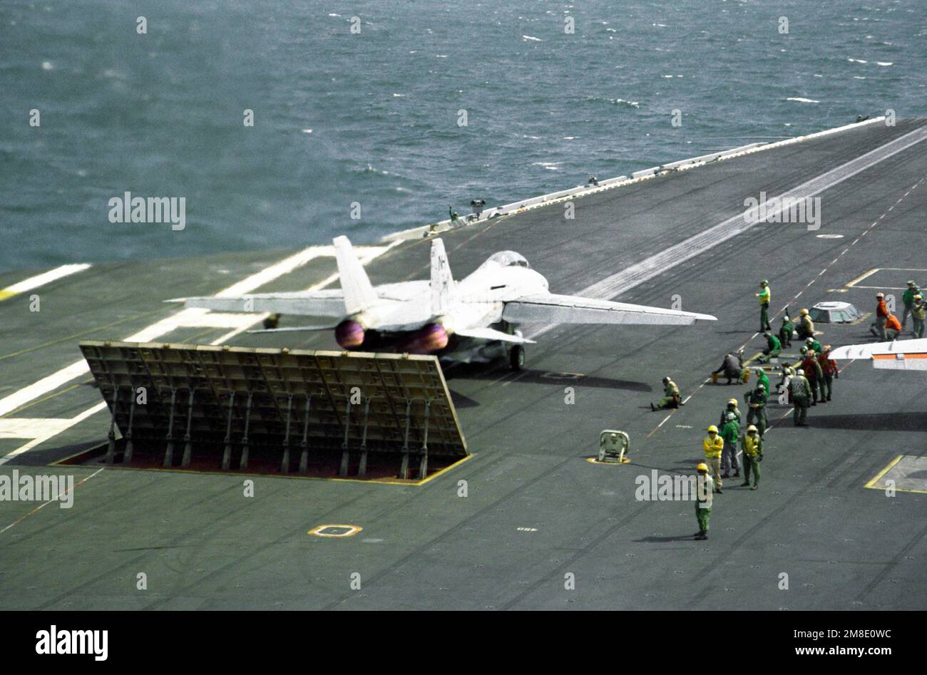 A Fighter Squadron 114 (VF114) F14A Tomcat aircraft stands by for