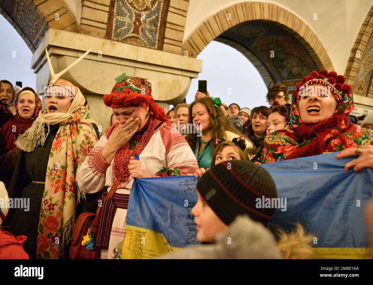 Kyiv, Ukraine. 13th Jan, 2023. Ukrainians wearing traditional and carnival  costumes sing carols as they gather at an underground metro station, due to  safety reason, to celebrate the winter holiday of Malanka,