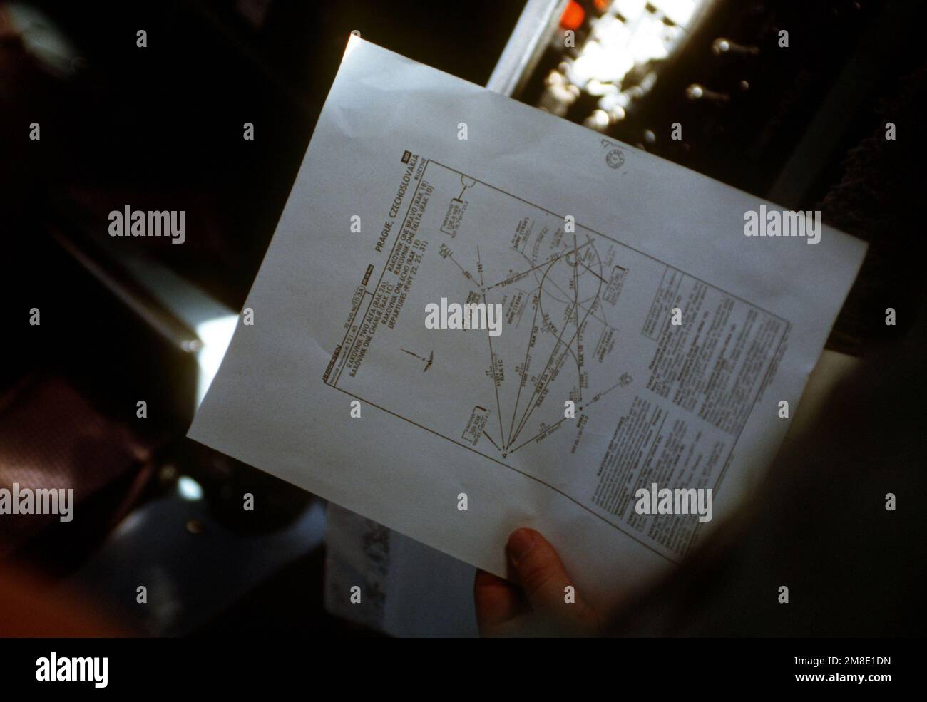 The navigator aboard a 60th Military Airlift Wing C-5B Galaxy aircraft checks over the approach and departure procedures for Prague, Czechoslovakia, as the aircraft nears the city. The aircraft is carrying 130,000 pounds of donated medical supplies to Prague, where they will be turned over to the Czech government for distribution. Country: Unknown Stock Photo