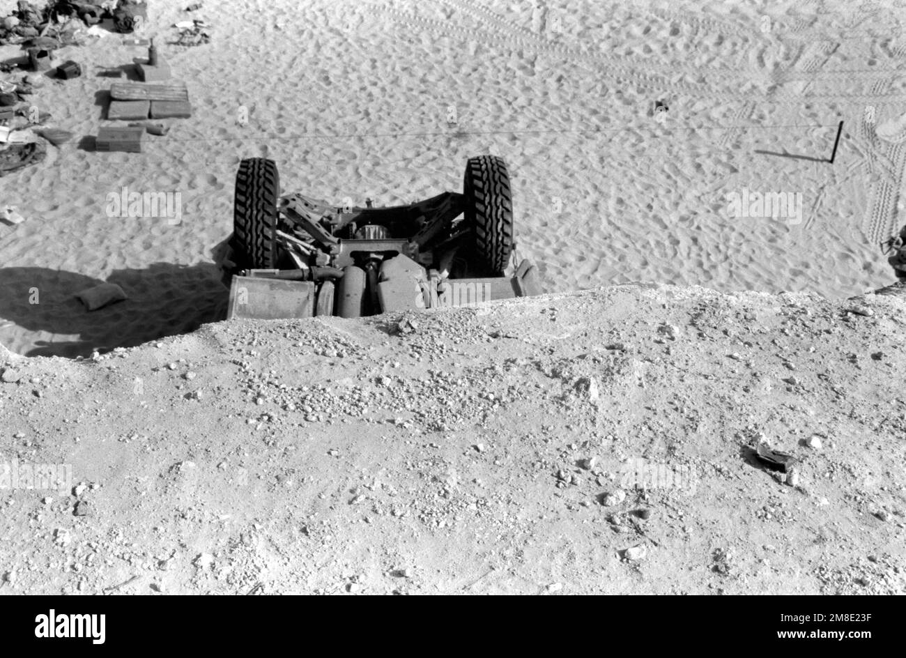 Edge of cliff. Rear axle of overturned M998 High-Mobility Multipurpose ...