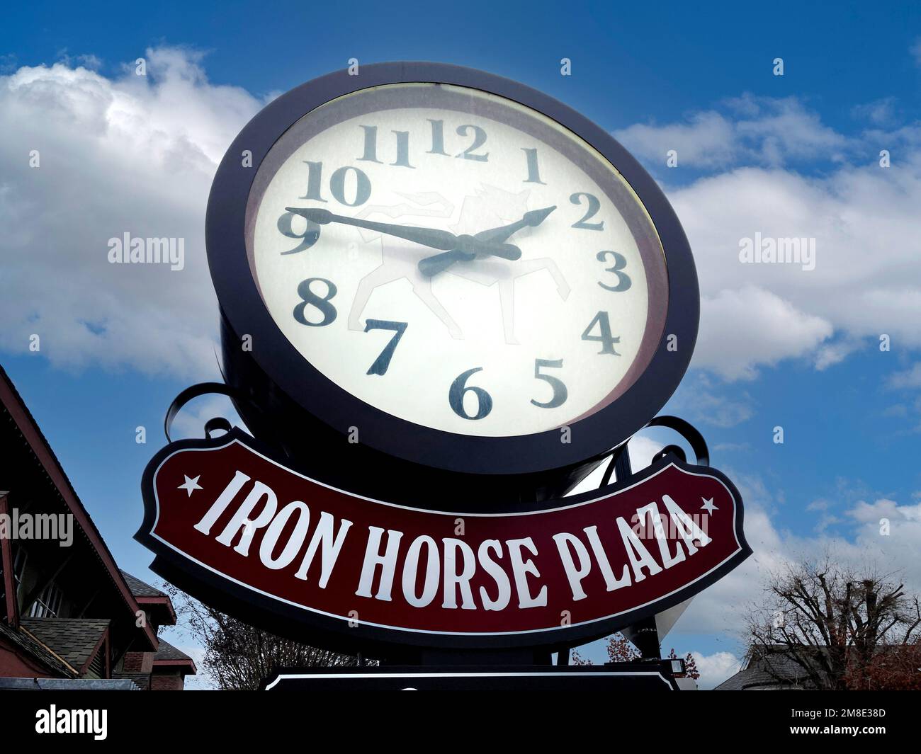 Iron Horse Plaza sign and round clock at shopping mall Danville
