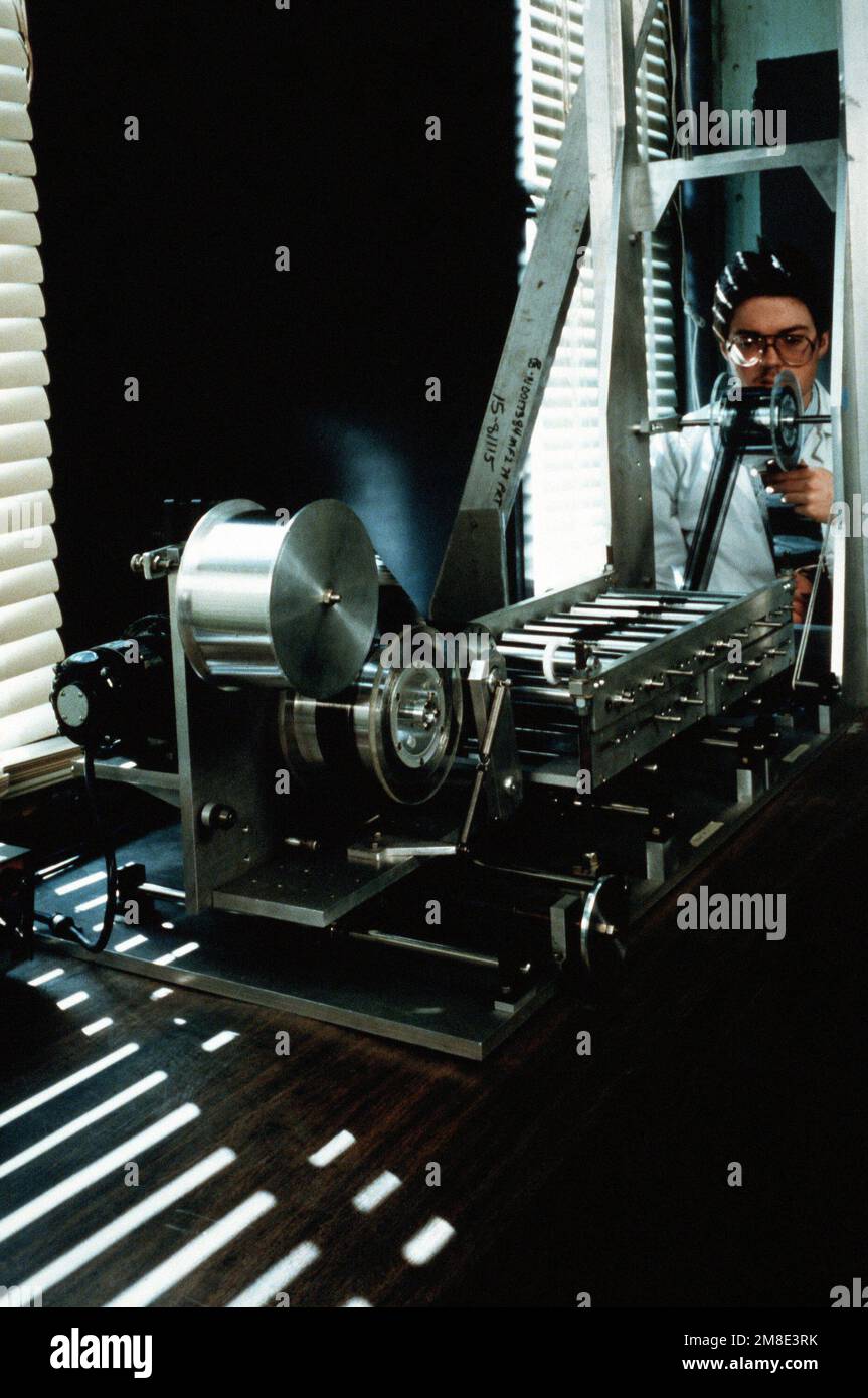 Bob Morris uses a fiber-spreading apparatus to prepare graphite fibers in the Metal Matrix Composite Integration Facility at the Naval Research Laboratory (NRL). Base: Washington State: District Of Columbia (DC) Country: United States Of America (USA) Stock Photo