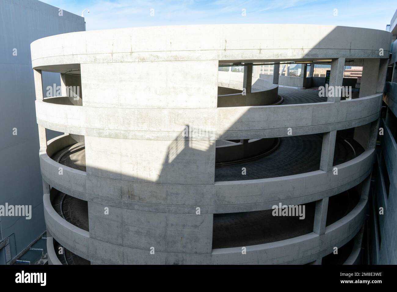 Circular, spiral parking garage ramp at multi story parking garage. Stock Photo