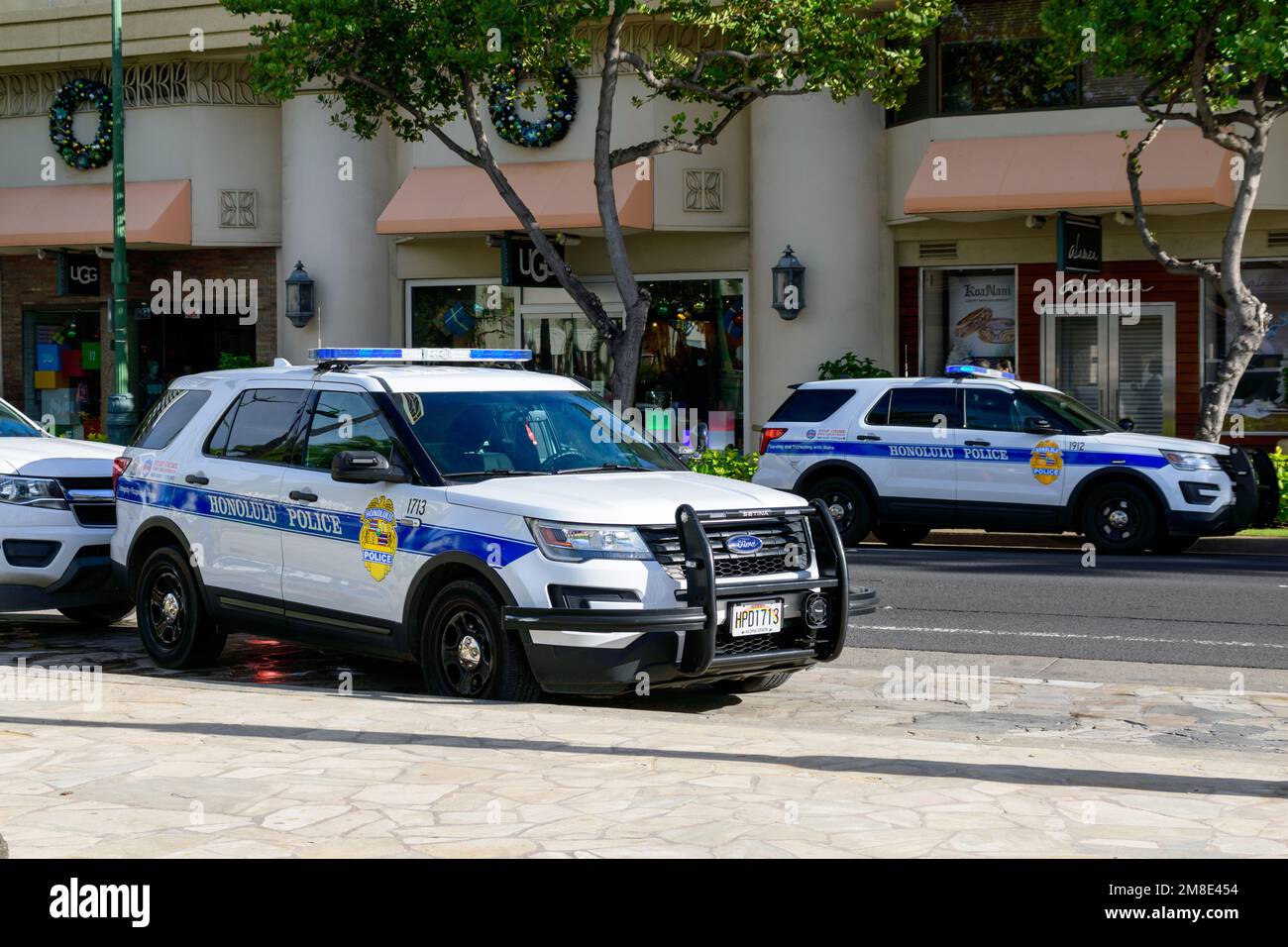 Honolulu Police Department police cars parked in Waikiki neighborhood on Kalakaua Avenue - Honolulu, Hawaii, USA - 2022 Stock Photo