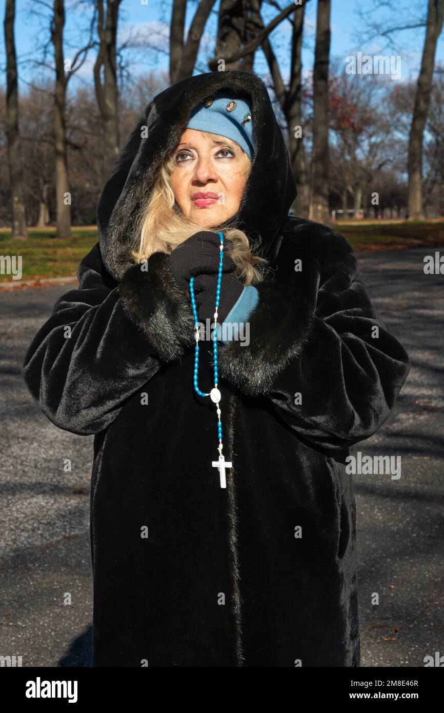 Devout Roman Catholic woman at a service the Vatican Pavilion site in Flushing Meadows Corona park where Mary & Jesus appeared to Veronica Lueken. NY Stock Photo