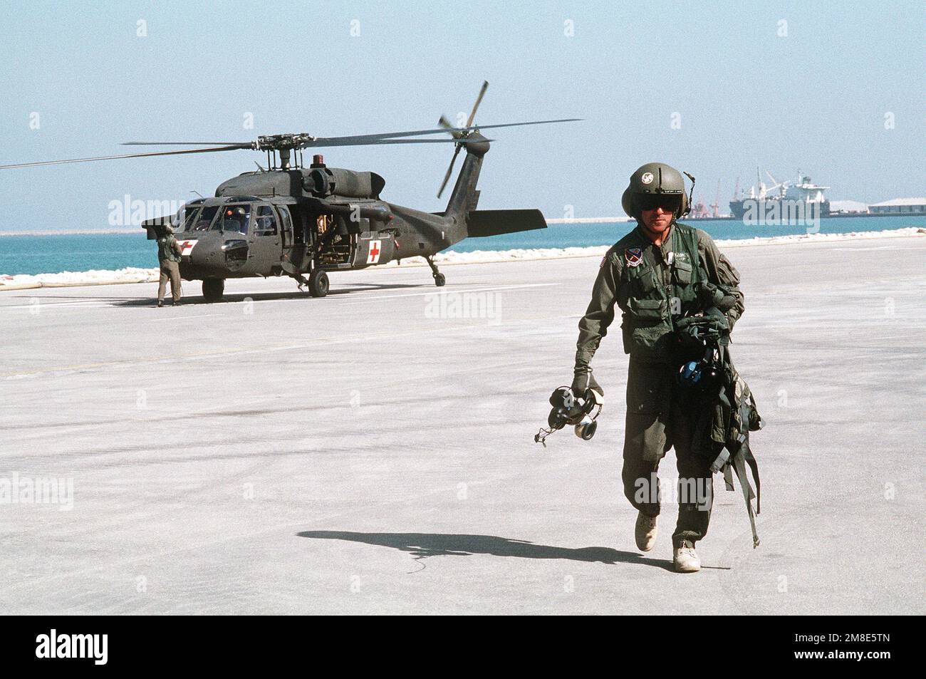 First SGT. Jeff Markoff of the Army's 45th Medical Company carries his ...