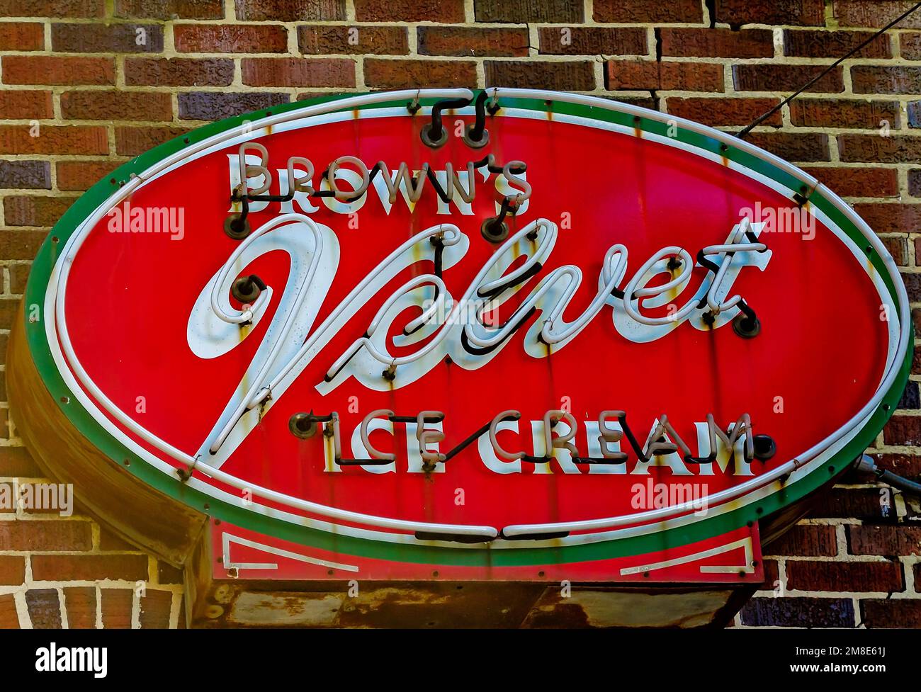 A neon sign advertising Brown’s Velvet Ice Cream hangs outside Lovelace Drugs, Dec. 28, 2022, in Ocean Springs, Mississippi. Stock Photo
