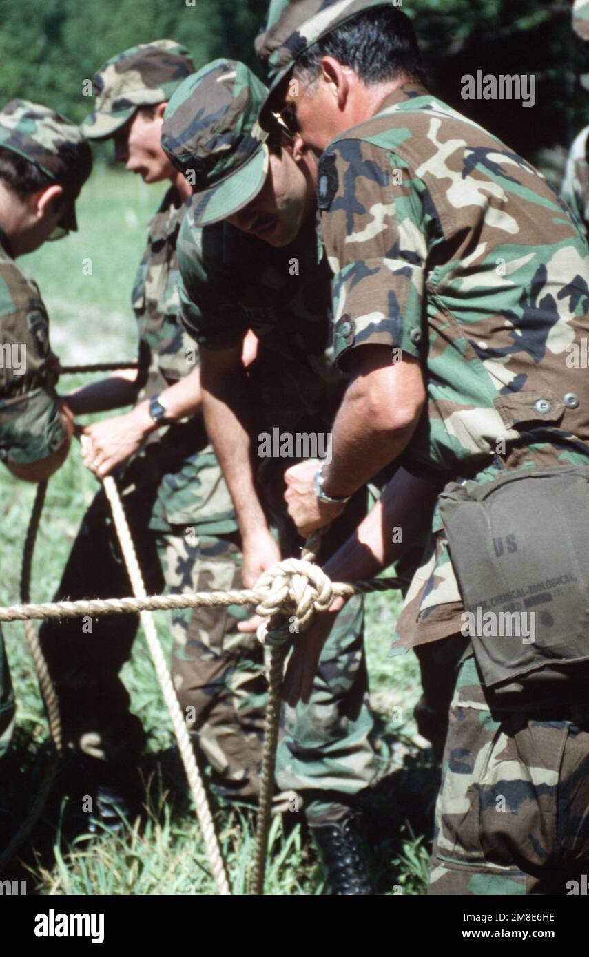 US Army reservists construct a rope bridge during a training exercise