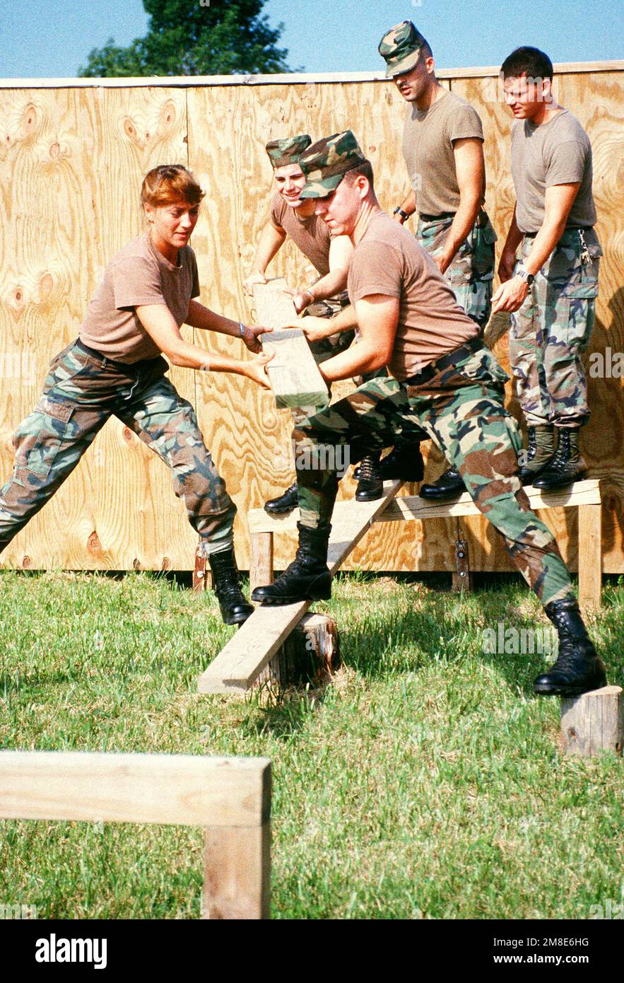 U.S. Army personnel take part in a teamwork exercise on the leadership ...