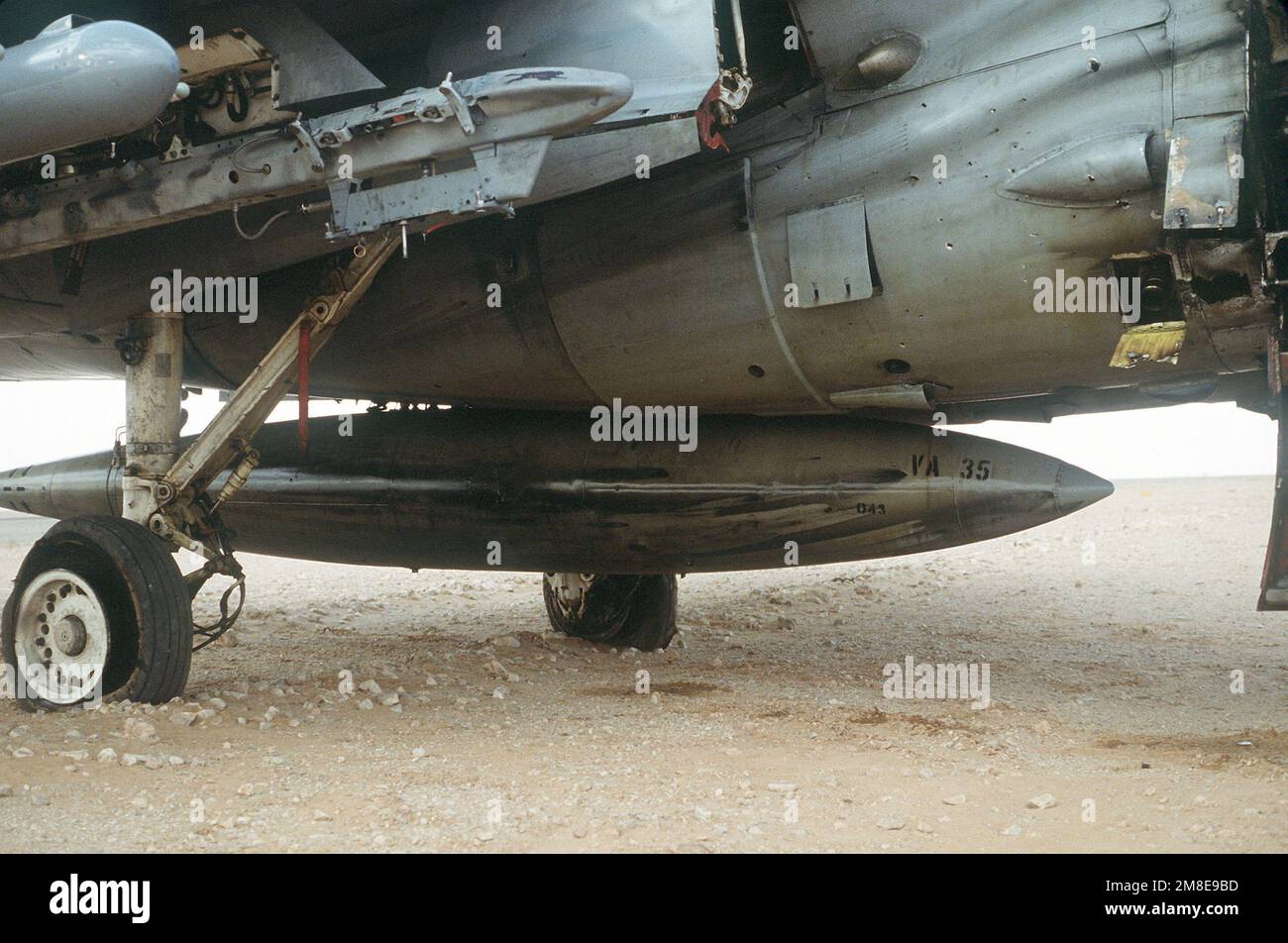 A fuel tank and the undercarriage of an A-6E Intruder attack aircraft from Attack Squadron 35 (VA-35), deployed from the aircraft carrier USS SARATOGA (CV-60), shows battle damage from a mission at the start of Operation Desert Storm.. Subject Operation/Series: DESERT STORM Country: Saudi Arabia(SAU) Stock Photo