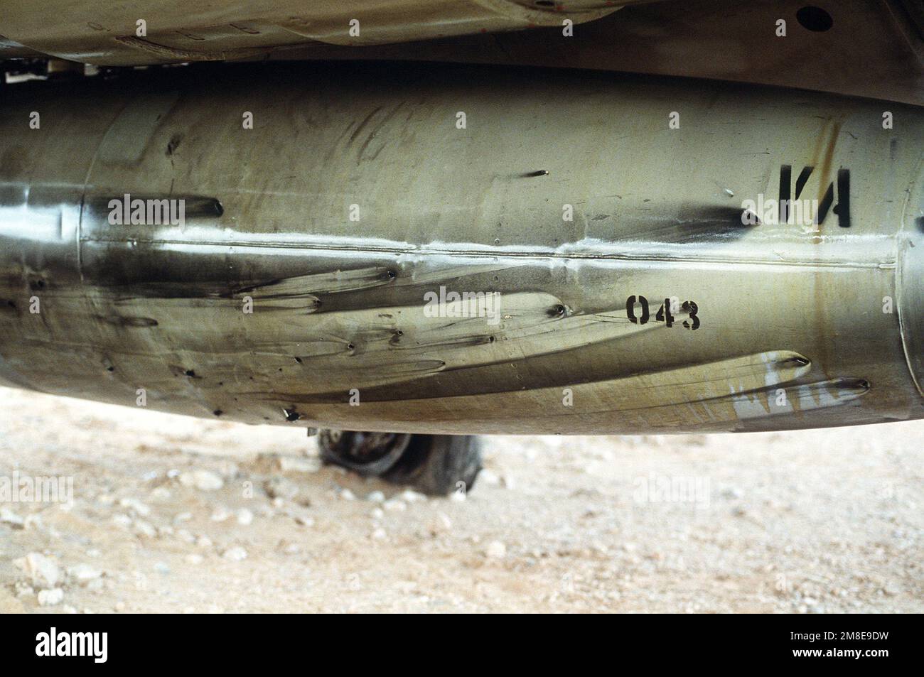 A fuel tank of an A-6E Intruder attack aircraft from Attack Squadron 35 (VA-35), deployed from the aircraft carrier USS SARATOGA (CV-60), shows battle damage from a mission at the start of Operation Desert Storm.. Subject Operation/Series: DESERT STORM Country: Saudi Arabia(SAU) Stock Photo