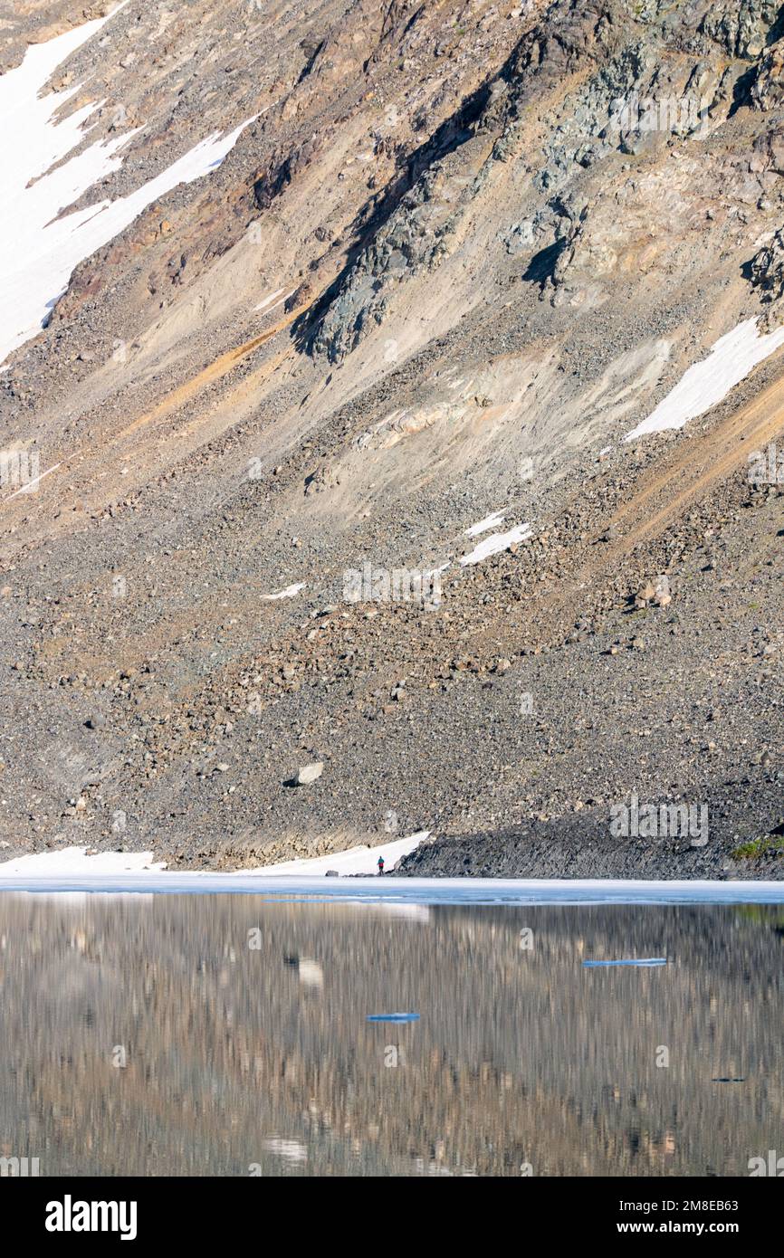 A person hiking in an incredible back country area of Yukon Territory during summer time near the Alaska border. Stock Photo