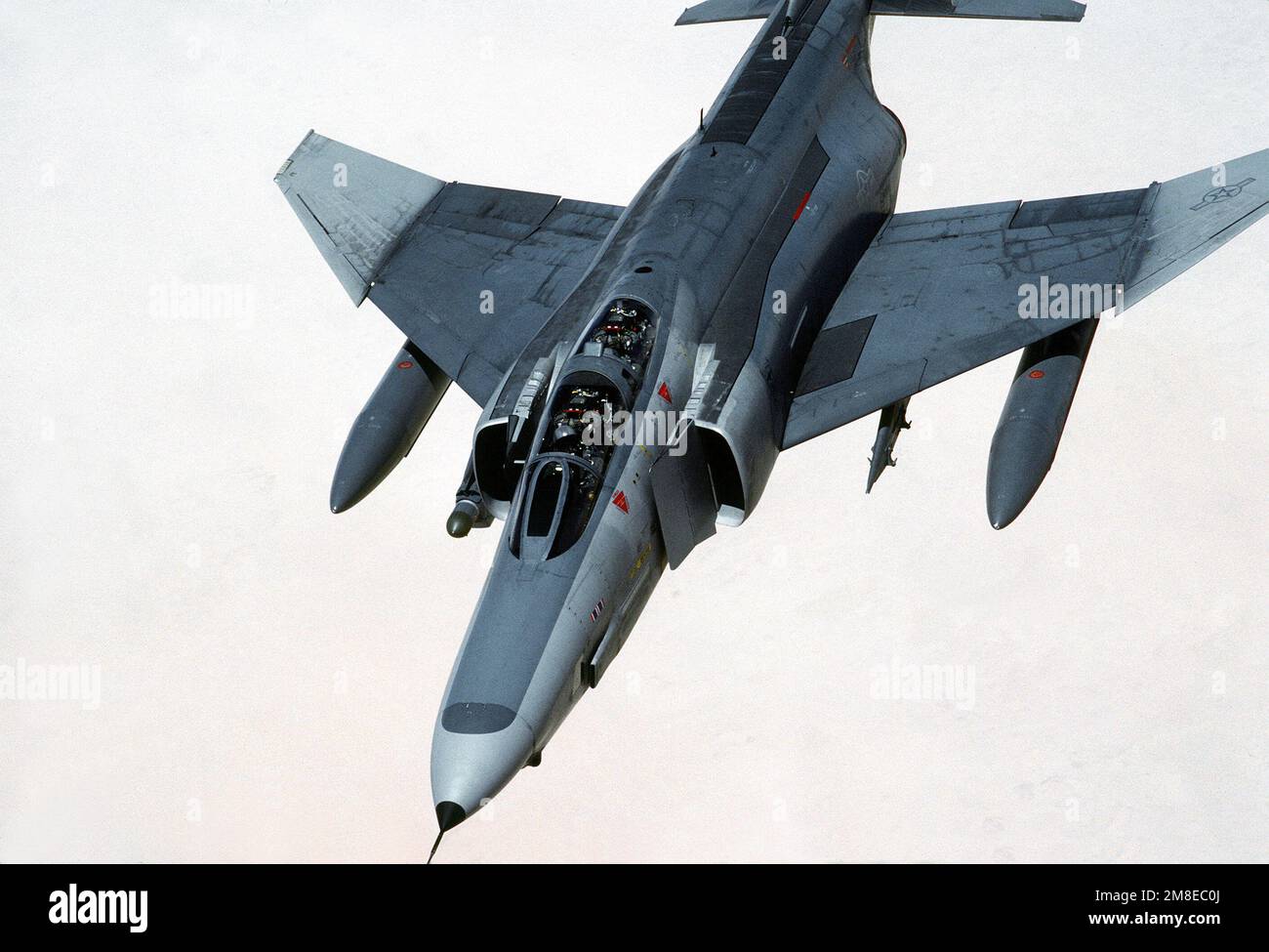 A 35th Tactical Fighter Wing F4E Phantom II aircraft passes over the