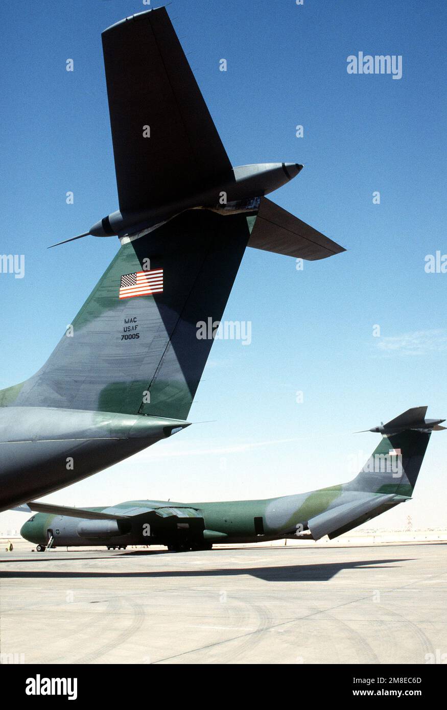 Military Airlift Command C-141B Starlifter aircraft are parked on the ...